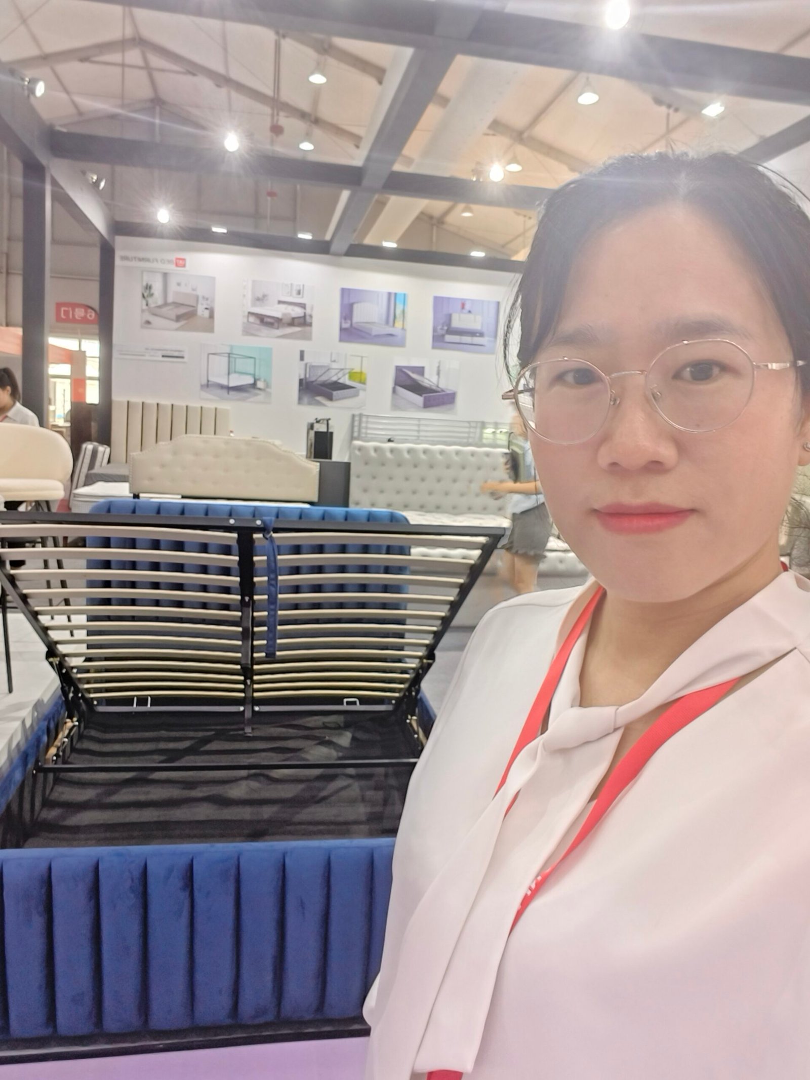 Sara presenting a storage bed in Lithuania