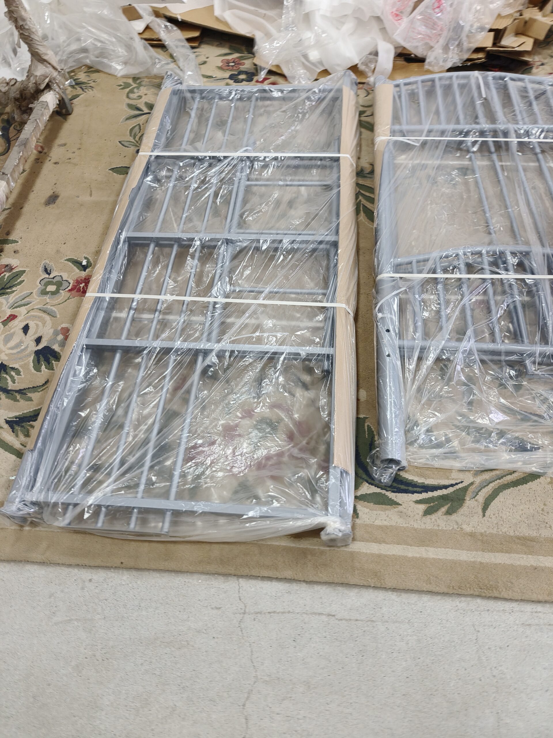 A close-up of a sturdy bunk bed weld and thick wood slat